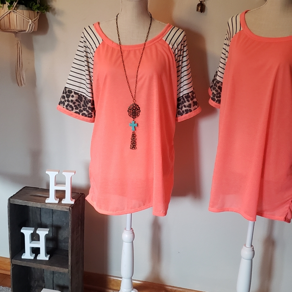 Neon coral with animal print sleeve detail.